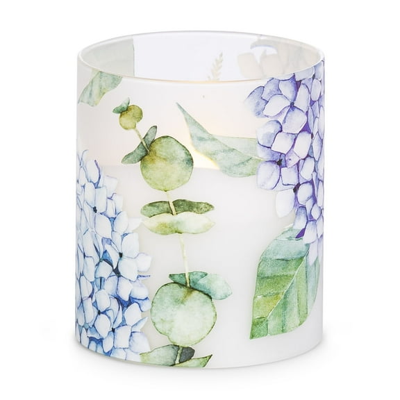 LED 3.5"D X 4"H Hand-Poured Wax Candle w/ Floral Design. Next Gen LED Flame Patented Technology w/ Adjustable Brightness Control. 2 C Batteries (Not Included). Multi Timer Function, 4, 6 & 8 hour.