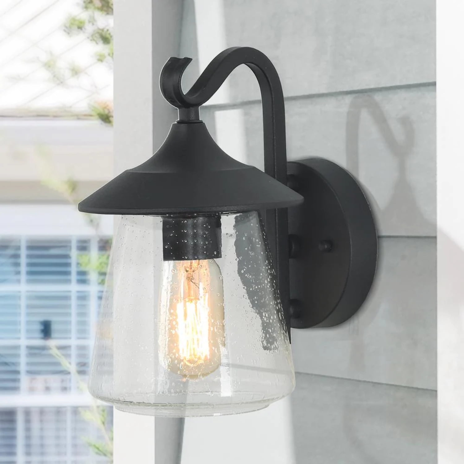Modern Black Metal Outdoor Lantern Sconce with Seeded Glass