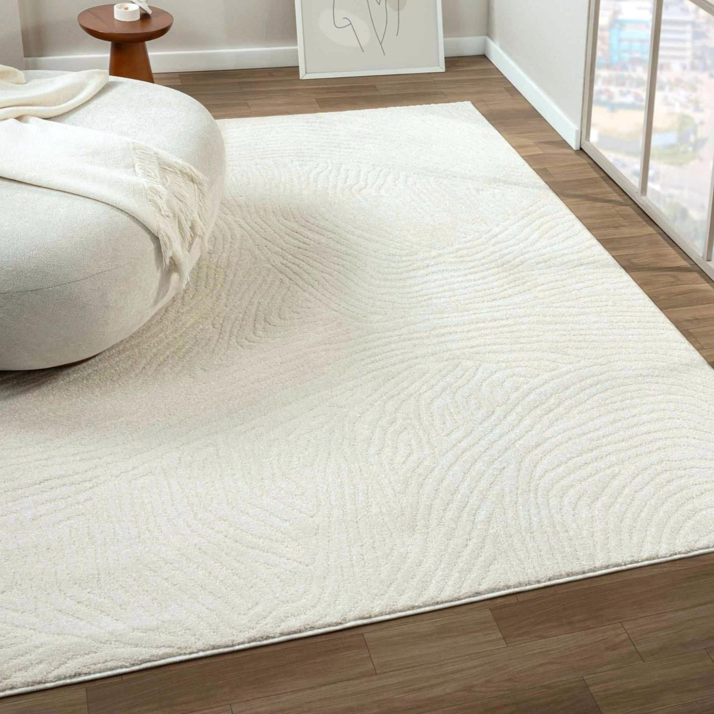 Cream Geometric Swirl 5' x 7' Synthetic Area Rug