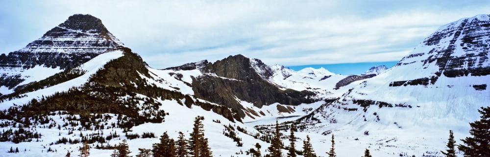 Lake flowing through mountains in winter Hidden Lake US Glacier National Park Montana USA Canvas Art - Panoramic Images (36 x 12)