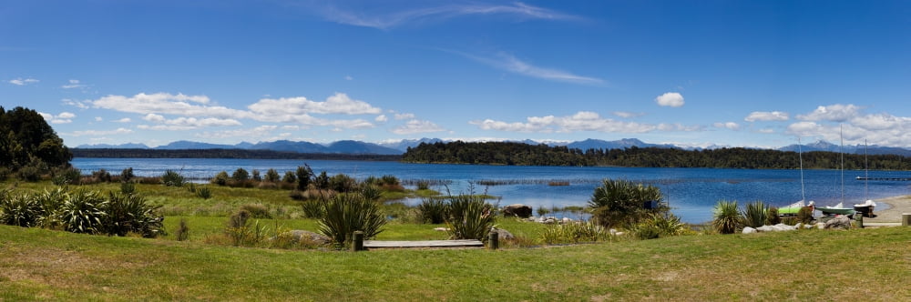 Lake with mountain range in the background Lake Mahinapua West Coast South Island New Zealand Canvas Art - Panoramic Images (27 x 9)