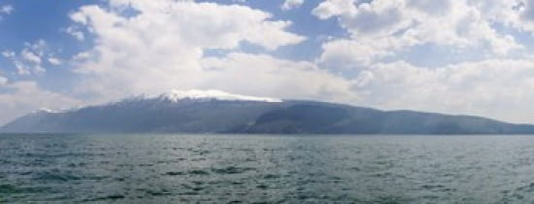 Lake with mountain range in the background Monte Baldo Lake Garda Lombardy Italy Canvas Art - Panoramic Images (15 x 6)