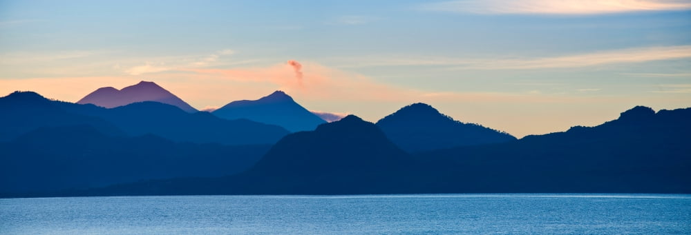 Lake with mountains in the background Lake Atitlan San Marcos Western Highlands Guatemala Canvas Art - Panoramic Images (36 x 12)