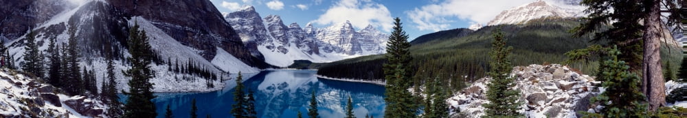 Lake with snow covered mountains in the background Moraine Lake Banff National Park Alberta Canada Canvas Art - Panoramic Images (22 x 4)