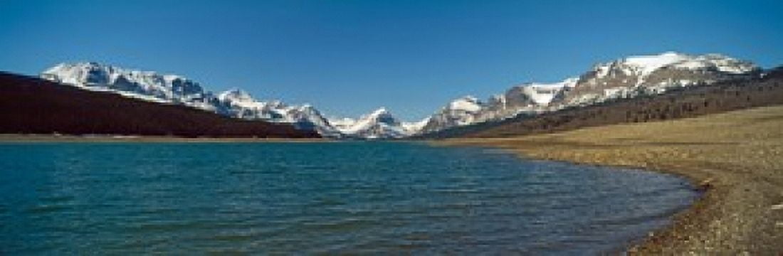 Lake with snow covered mountains in the background Sherburne Lake US Glacier National Park Montana USA Canvas Art - Panoramic Images (18 x 6)