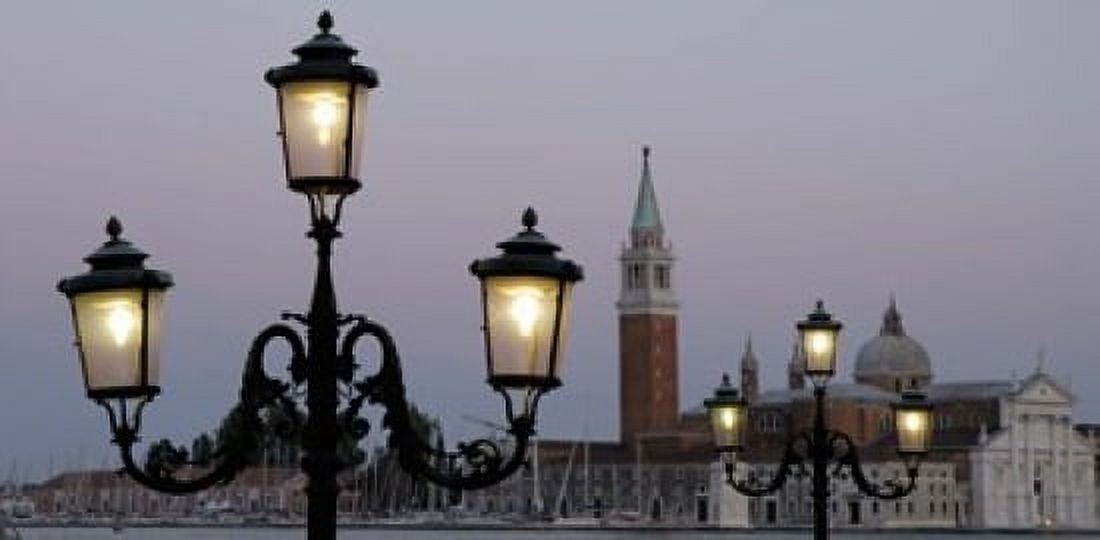 Lampposts lit up at dusk with building in the background San Giorgio Maggiore Venice Italy Canvas Art - Panoramic Images (16 x 8)
