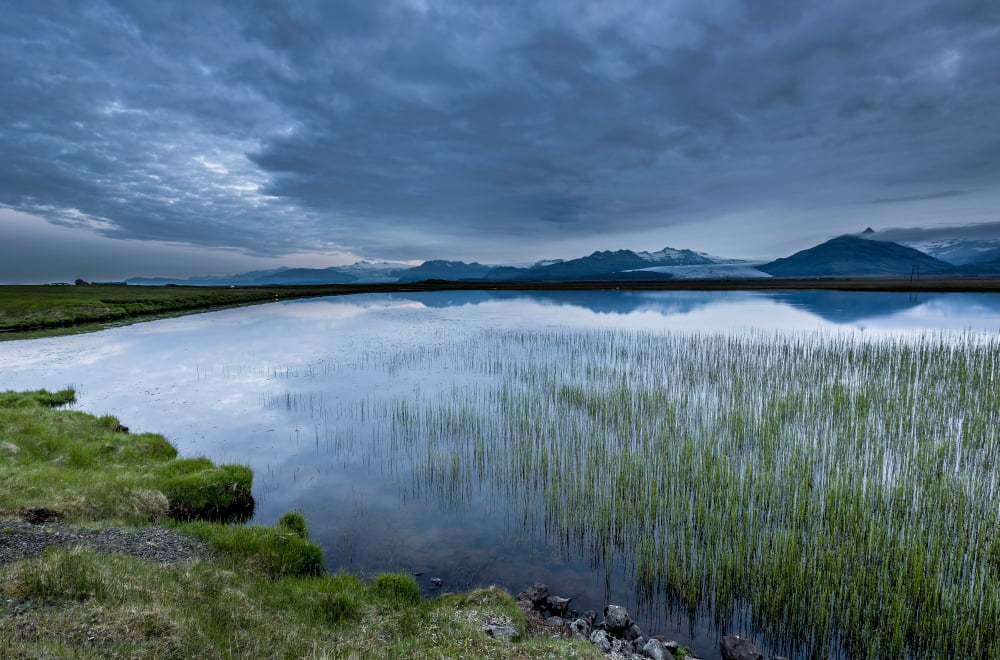 Landscape with water grass and Heinabergsjokull glacier Skalafellsjokull glacier Iceland Canvas Art - Panoramic Images (27 x 9)
