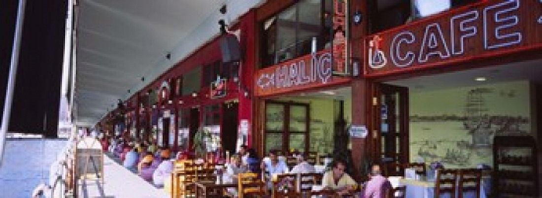 Large group of people sitting in a cafe Istanbul Turkey Canvas Art - Panoramic Images (18 x 7)