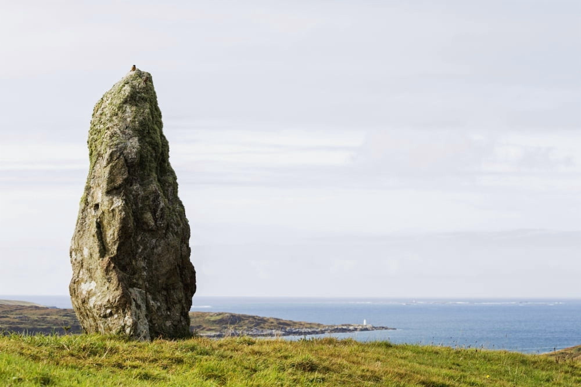 Large megalithic rock in grassy field overlooking bay with hazy blue sky Clifden County Galway Ireland Canvas Art - Michael Interisano Design Pics (38 x 24)
