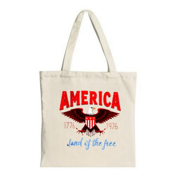 Large red eagle design with in bold red years " 1776 " & " 1778 " and " Land of the free " in blue cursive on a sturdy canvas tote