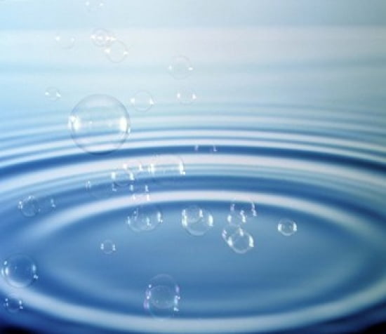 Large rings in blue water with bubbles Canvas Art - Panoramic Images (24 x 21)