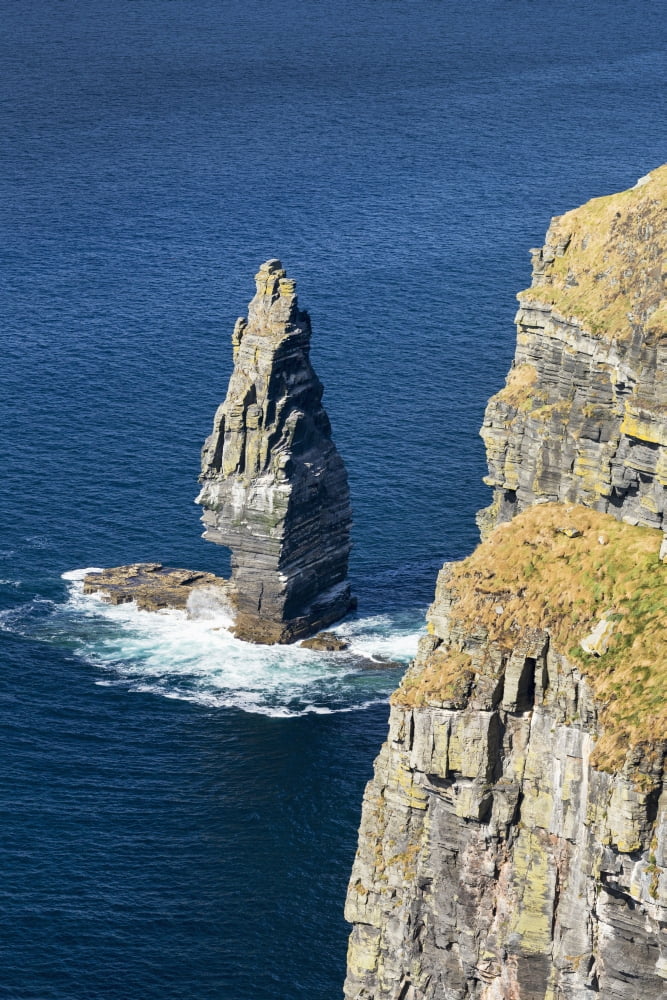 Large sea stack rock structure in the ocean with cliffs Liscannor County Clare Ireland Canvas Art - Michael Interisano Design Pics (12 x 19)