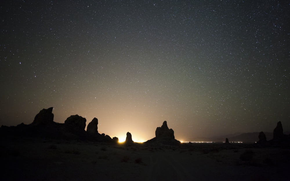 Large tufa formations at Trona Pinnacles against a backdrop of stars Canvas Art - Dan BarrStocktrek Images (18 x 12)
