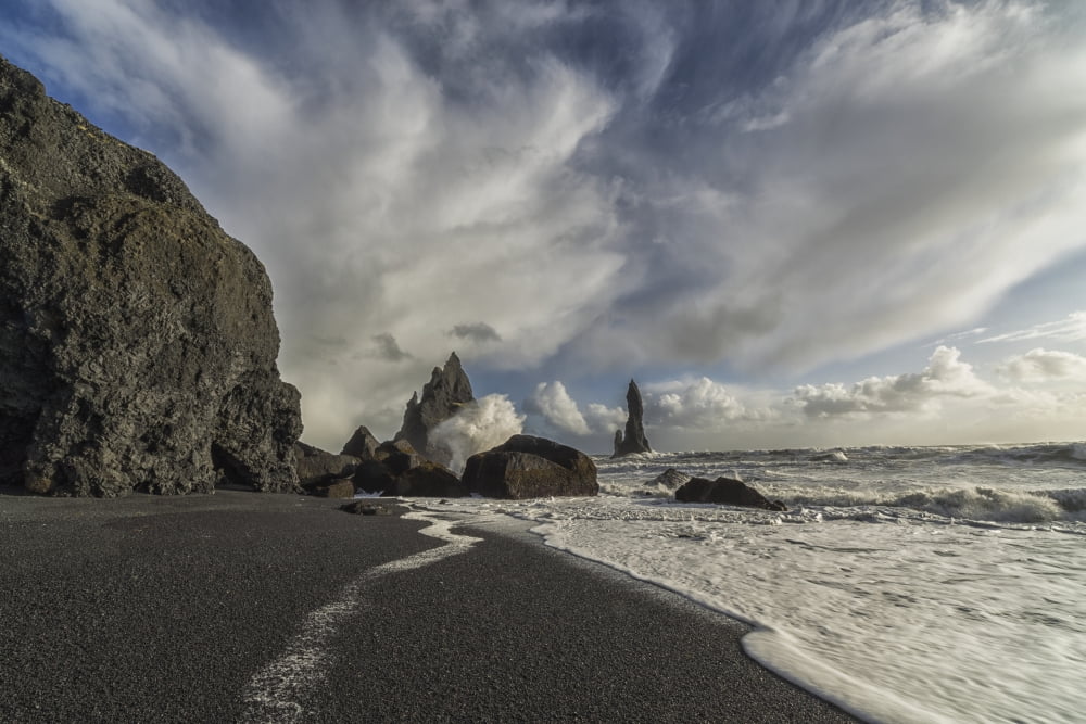 Large waves crash against the shoreline and sea stacks on the southern shore of Iceland near Vik Iceland Canvas Art - Robert Postma Design Pics (19 x 12)