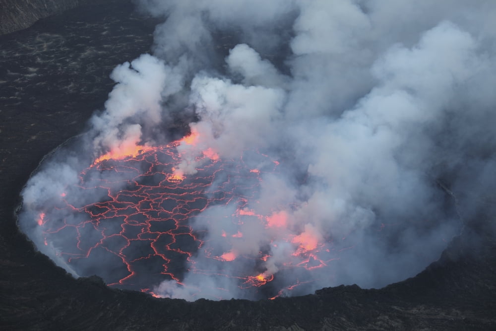 Lava Lake with small lava fountains Nyiragongo Volcano Democratic Republic of the Congo Canvas Art - Richard RoscoeStocktrek Images (35 x 23)