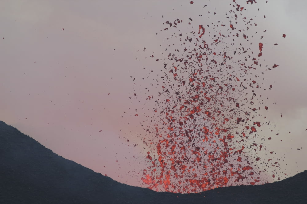 Lava bombs expelled during a basaltic fissure eruption on Nyamuragira Volcano Canvas Art - Richard RoscoeStocktrek Images (30 x 20)