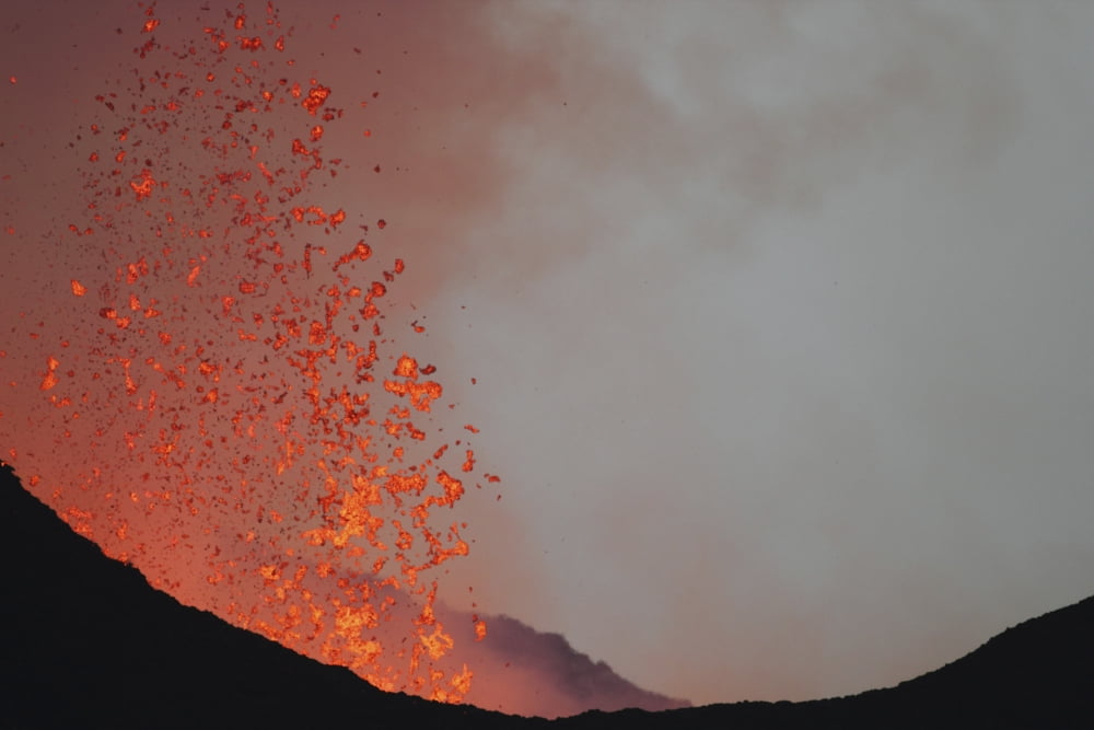 Lava bombs expelled during a basaltic fissure eruption on Nyamuragira Volcano Canvas Art - Richard RoscoeStocktrek Images (30 x 20)
