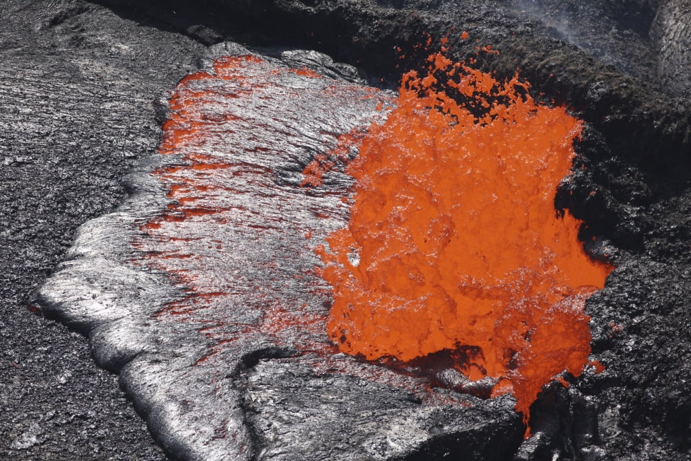 Lava bursting at edge of active lava lake Erta Ale volcano Danakil Depression Ethiopia Canvas Art - Richard RoscoeStocktrek Images (35 x 23)