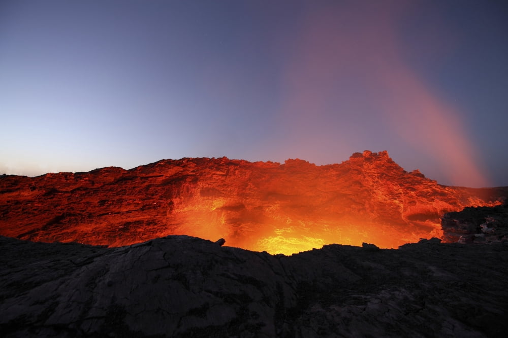 Lava lake illuminating walls of pit crater at night Erta Ale volcano Danakil Depression Ethiopia Canvas Art - Richard RoscoeStocktrek Images (35 x 23)