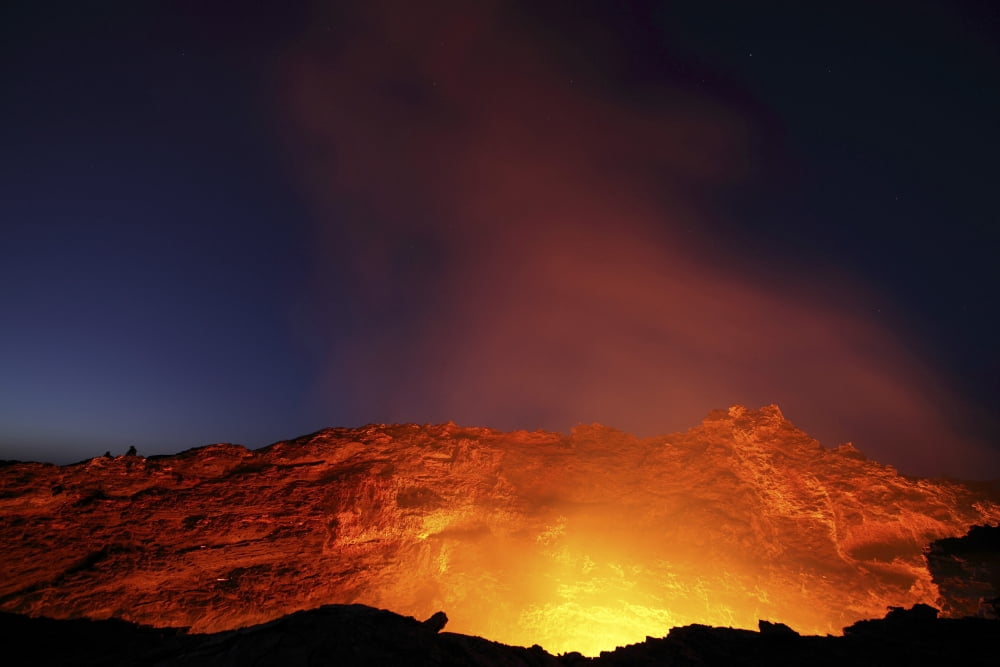 Lava lake illuminating walls of pit crater at night Erta Ale volcano Danakil Depression Ethiopia Canvas Art - Richard RoscoeStocktrek Images (35 x 23)
