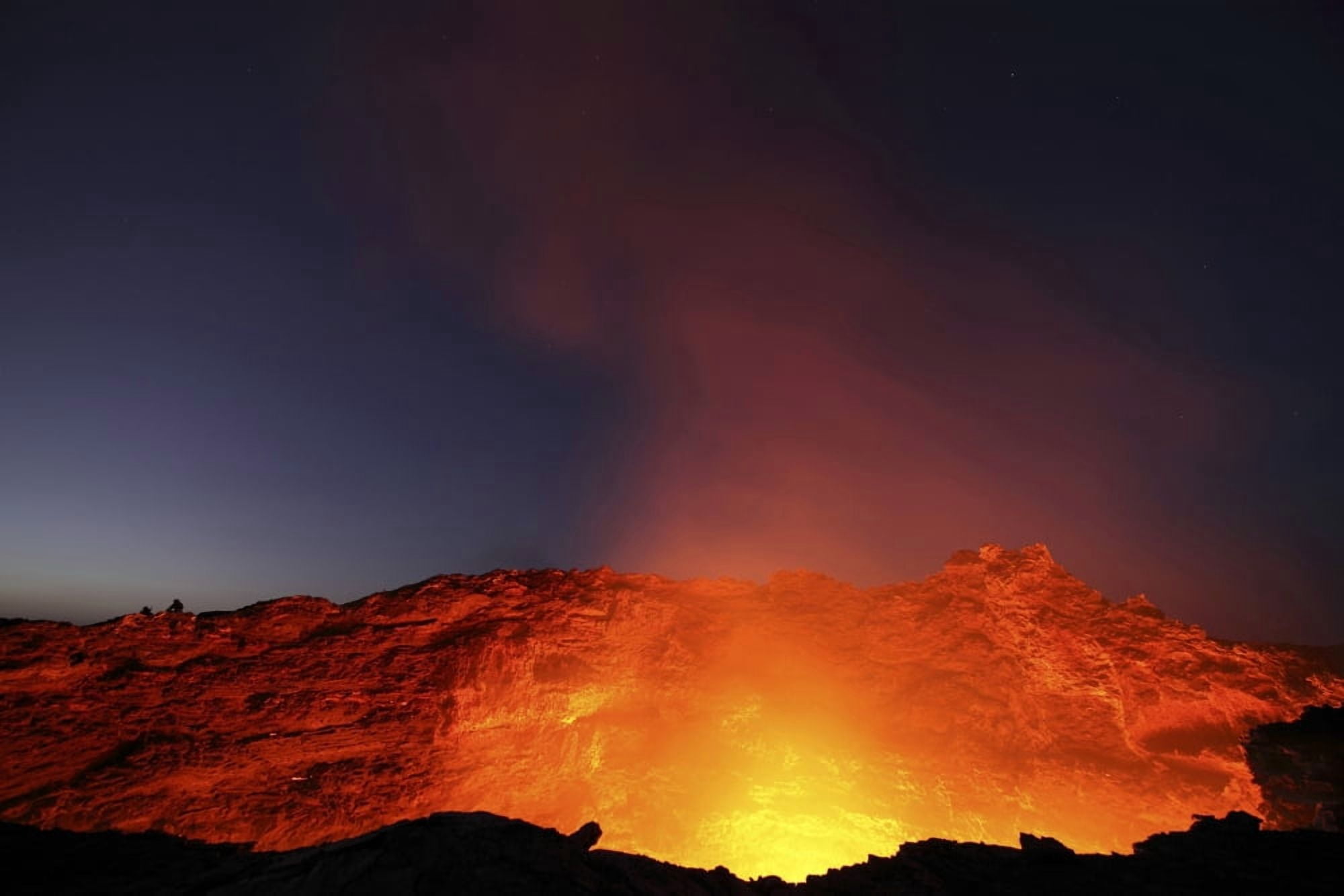 Lava lake illuminating walls of pit crater at night Erta Ale volcano Danakil Depression Ethiopia Canvas Art - Richard RoscoeStocktrek Images (35 x 23)