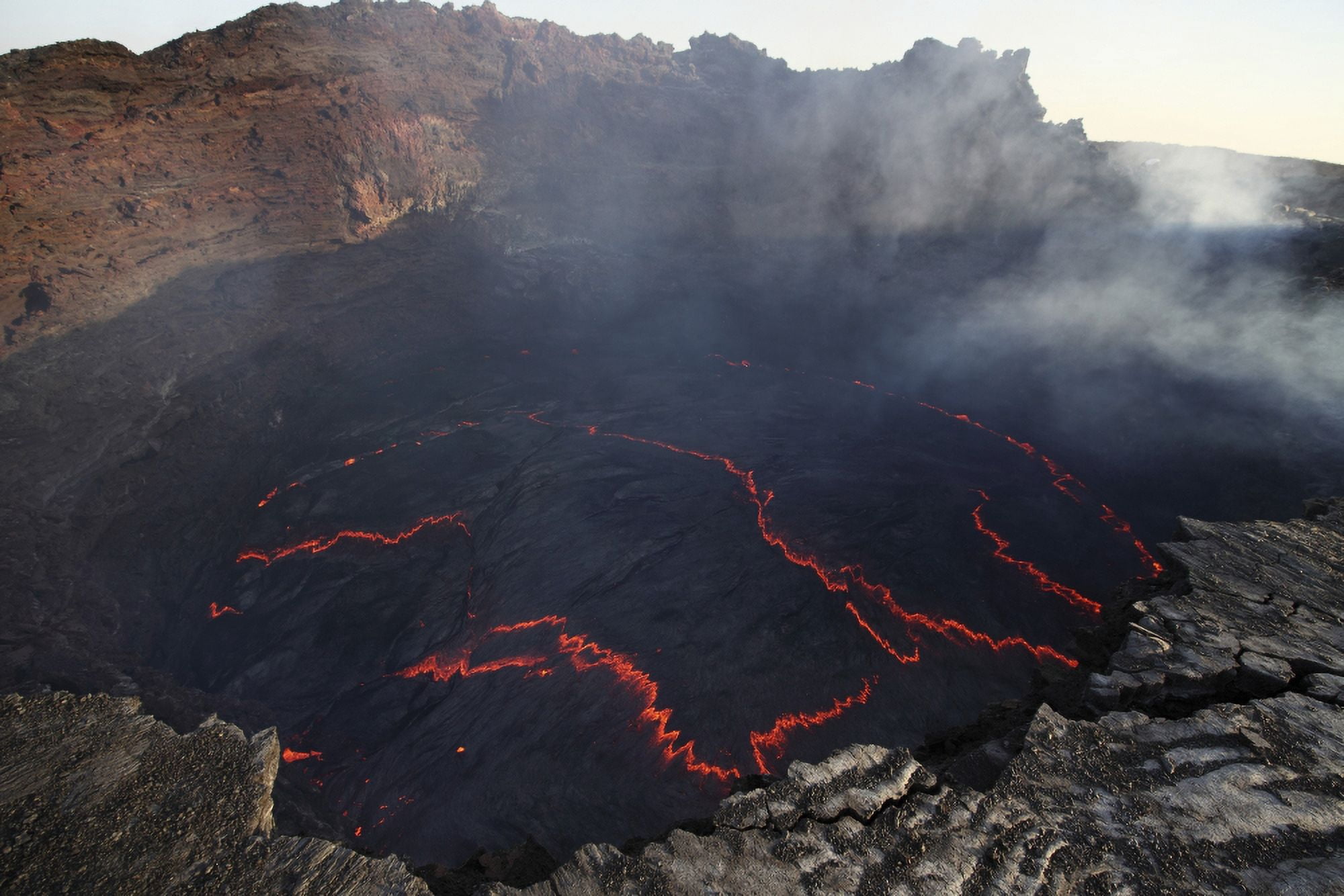 Lava lake in pit crater Erta Ale volcano Danakil Depression Ethiopia Canvas Art - Richard RoscoeStocktrek Images (18 x 12)