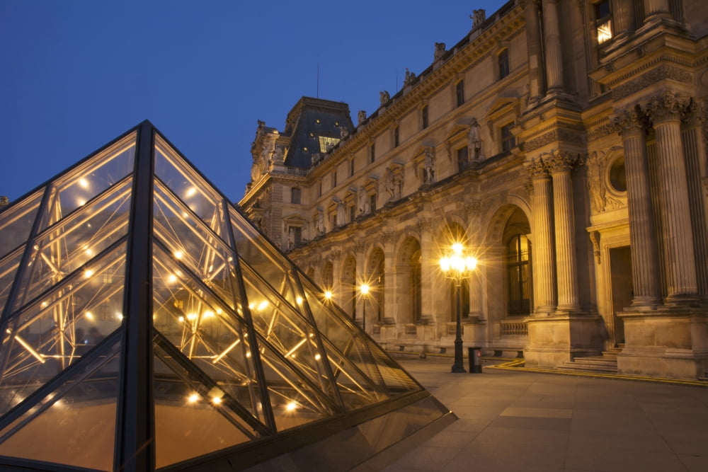 Le Louvre palace buildings and pyramids at night in golden light Paris France Canvas Art - Philippe Widling Design Pics (40 x 26)