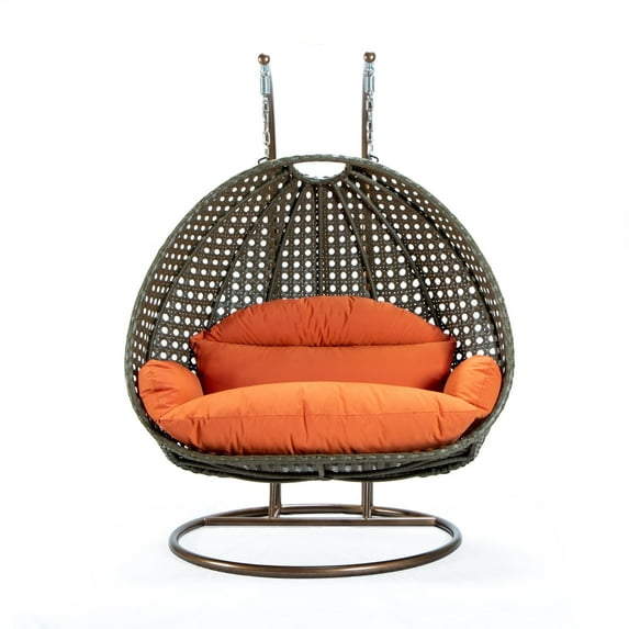 LeisureMod 2-Person Hanging Wicker Egg Chair with Stand, Indoor/Outdoor Patio Swing Hammock Lounge with UV-Resistant Beige Cushions, Dark Orange