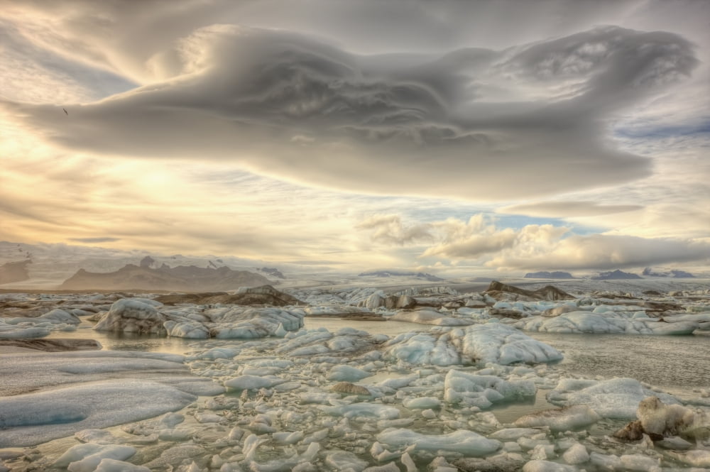 Lenticular Clouds Over The Ice Lagoon Of Jokulsarlon Iceland Canvas Art - Robert Postma Design Pics (17 x 11)