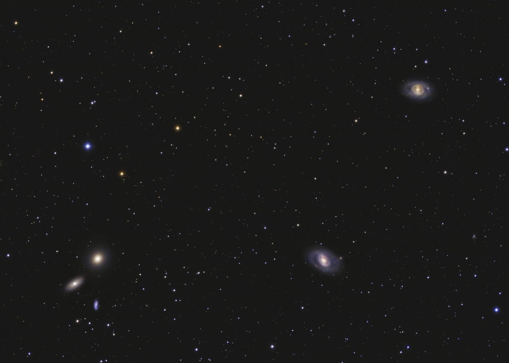 Leo I galaxy cluster showing Messier 95 Messier 96 and Messier 105 Canvas Art - Lorand FenyesStocktrek Images (33 x 24)