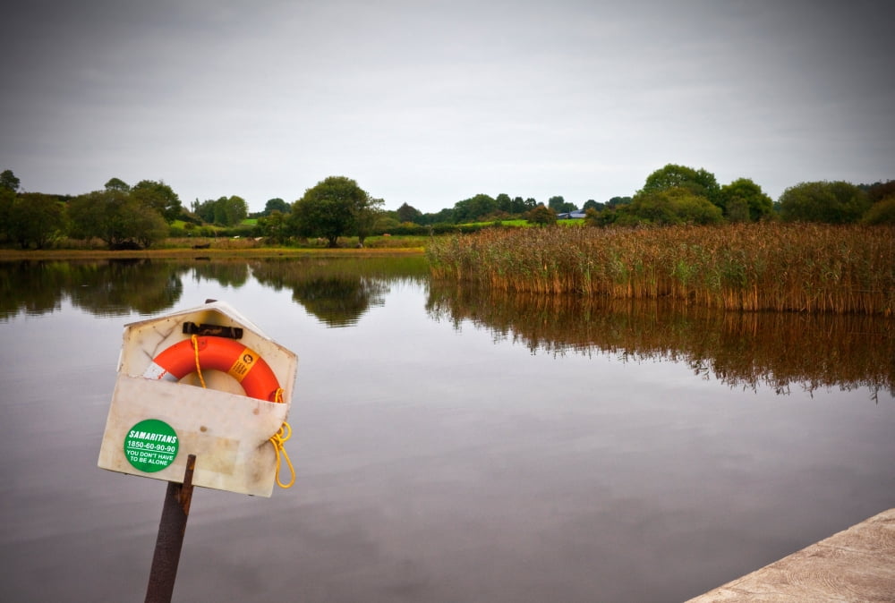Lifebelt and sign for the Samaritans alongside a slipway into Lough MacNean County Fermanagh Northern Ireland Canvas Art - Panoramic Images (24 x 18)