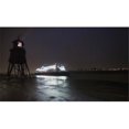 thumbnail image 1 of Light streaming from a lighthouse on the coast as an illuminated cruise ship passes by; South Shields Tyne and Wear En 1, 1 of 2