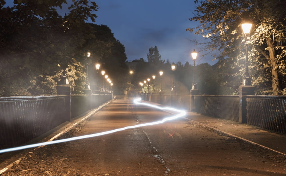 Light trail glowing in a path lit by lamp posts at dusk Newcastle Tyne and Wear England Canvas Art - John Short Design Pics (38 x 24)