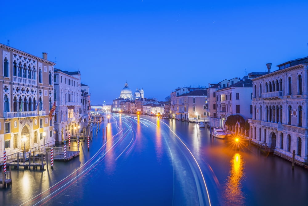 Light trails on a canal at dusk with the illuminated Salute church in the distance Venice Veneto Italy Canvas Art - Mats Silvan Design Pics (38 x 24)