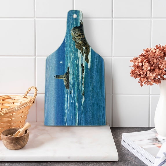 Lighthouse Cutting Board, Daytime Lighthouse Wavy Ocean View and Clear Sky Rocky Islands Sailboat, Tempered Glass Cutting and Serving Board, Wine Bottle Shape, Blue Grey White, by Ambesonne