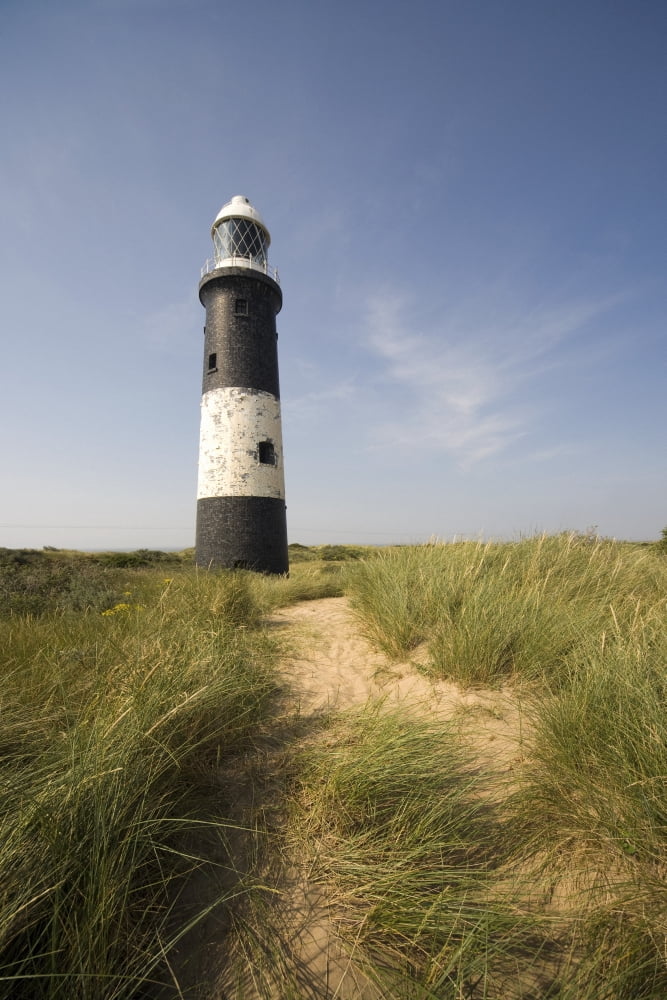 Lighthouse In The Dunes Canvas Art - John Short Design Pics (12 x 18)
