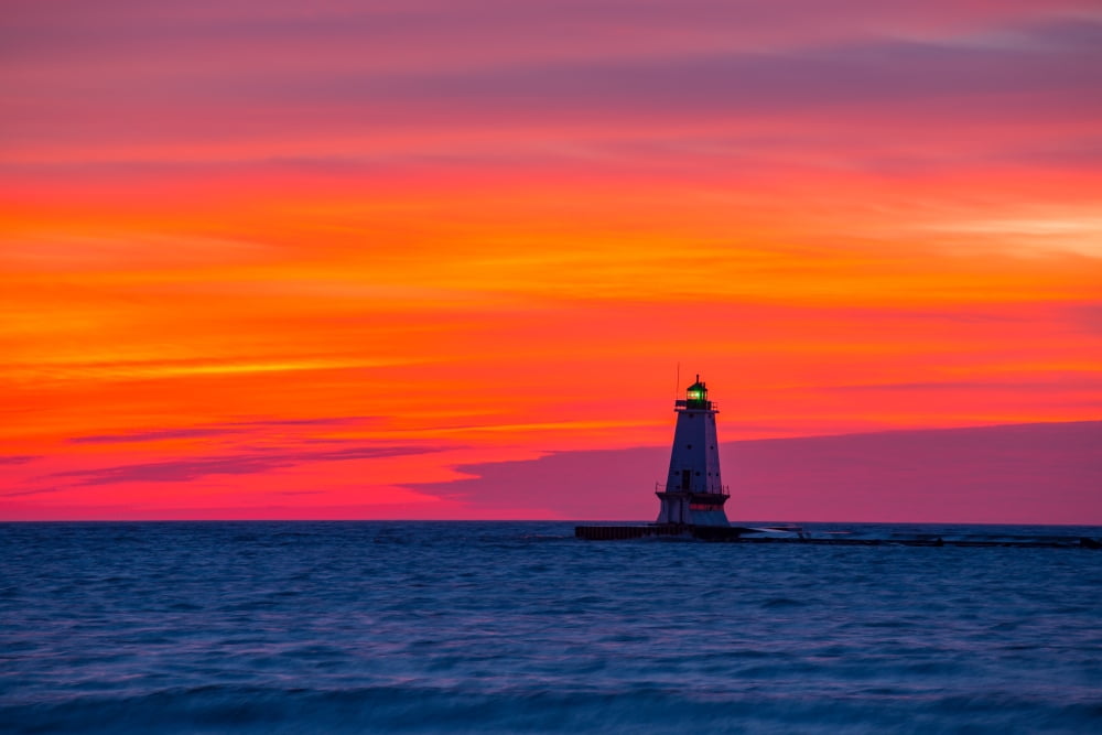 Lighthouse on the coast at dusk Ludington North Pierhead Lighthouse Lake Michigan Ludington Mason County Michigan USA Canvas Art - Panoramic Images (18 x 24)