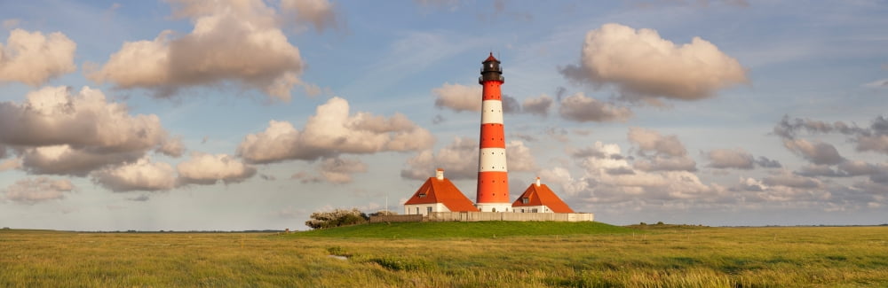 Lighthouse in a farm Westerheversand Lighthouse Westerhever Eiderstedt Schleswig-Holstein Germany Canvas Art - Panoramic Images (27 x 9)