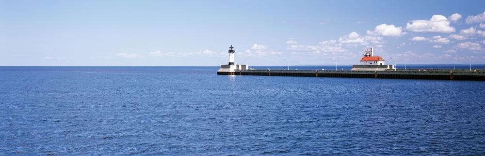 Lighthouse on a pier in a lake Lake Superior Duluth Minnesota USA Canvas Art - Panoramic Images (6 x 18)