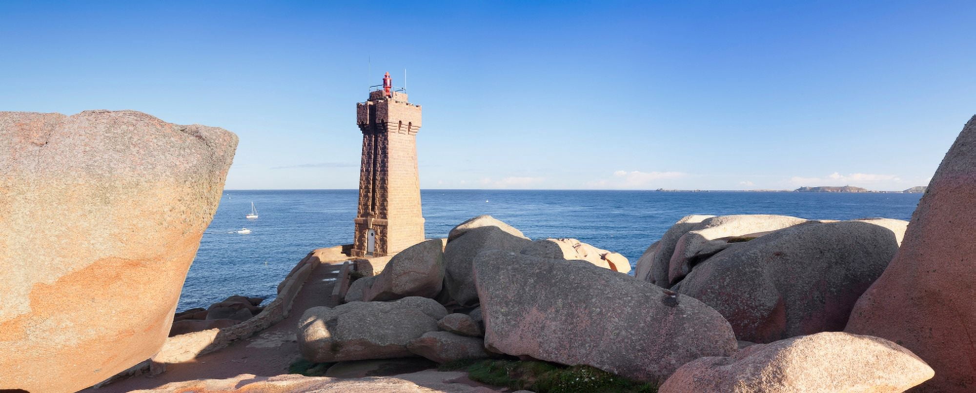 Lighthouse on the coast Leuchtturm Von Meen Ruz Ploumanach Cote De Granit Rose Cotes-dArmor Brittany France Canvas Art - Panoramic Images (27 x 9)