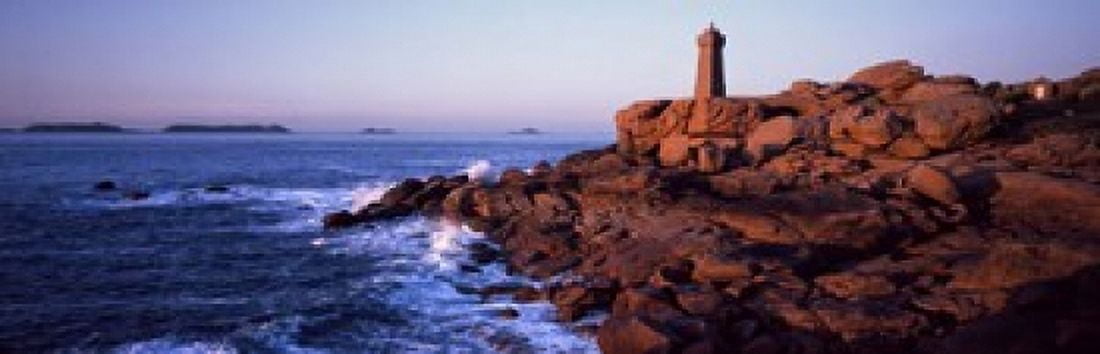Lighthouse on the coast Ploumanach Lighthouse Cote De Granit Rose Cotes-DArmor Brittany France Canvas Art - Panoramic Images (18 x 6)