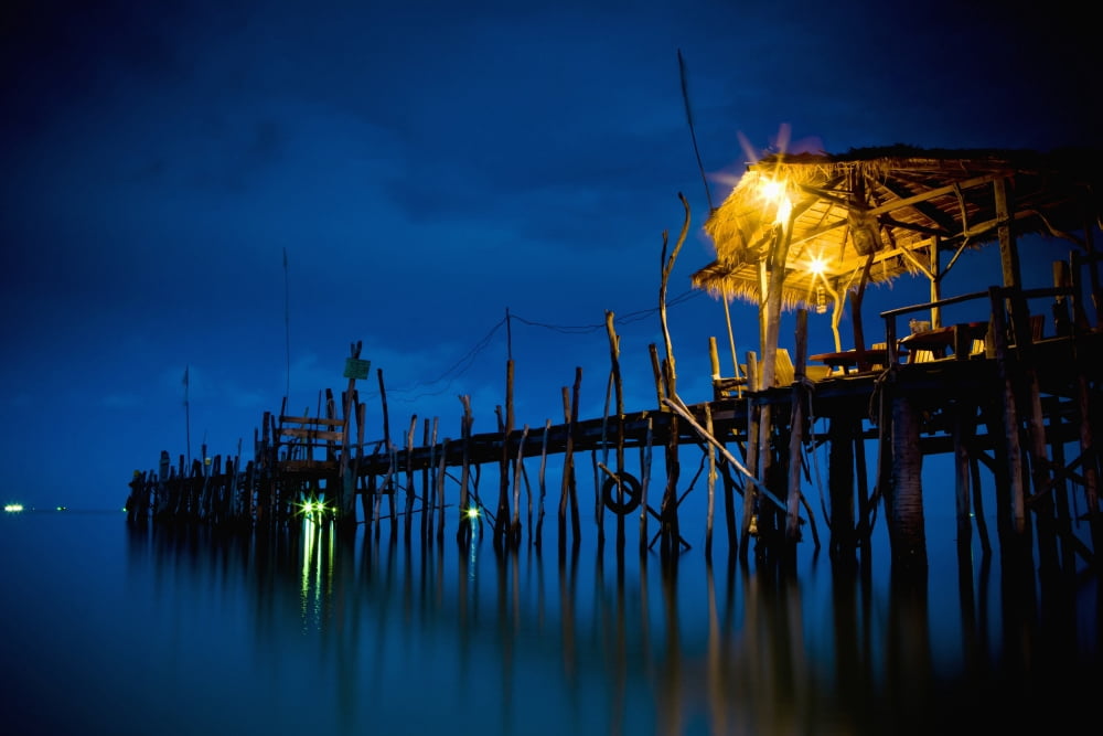 Lights On A Wooden Pier Leading Out In The Water At Night Kho SametThailand Canvas Art - David DuChemin Design Pics (19 x 12)