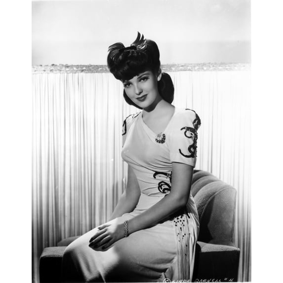 Linda Darnell sitting wearing White Dress in Black and White Photo Print (24 x 30)