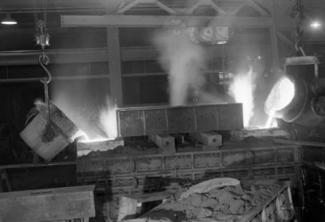 Liquid metal is flowing from buckets in steelworks Canvas Art -  (24 x 36)