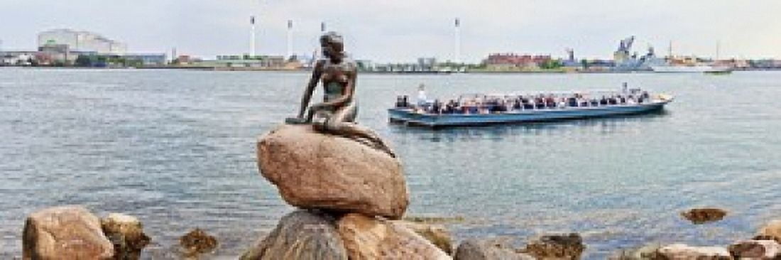 Little Mermaid Statue with tourboat in a canal Copenhagen Denmark Canvas Art - Panoramic Images (18 x 6)