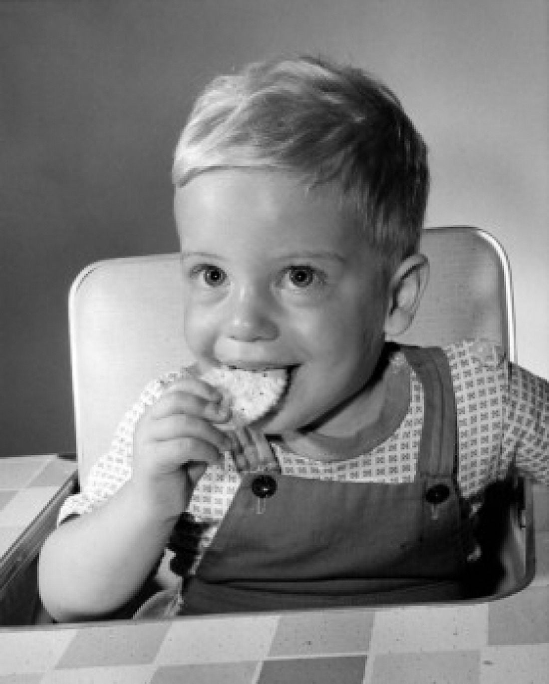 Little boy eating biscuit Canvas Art - (24 x 36)