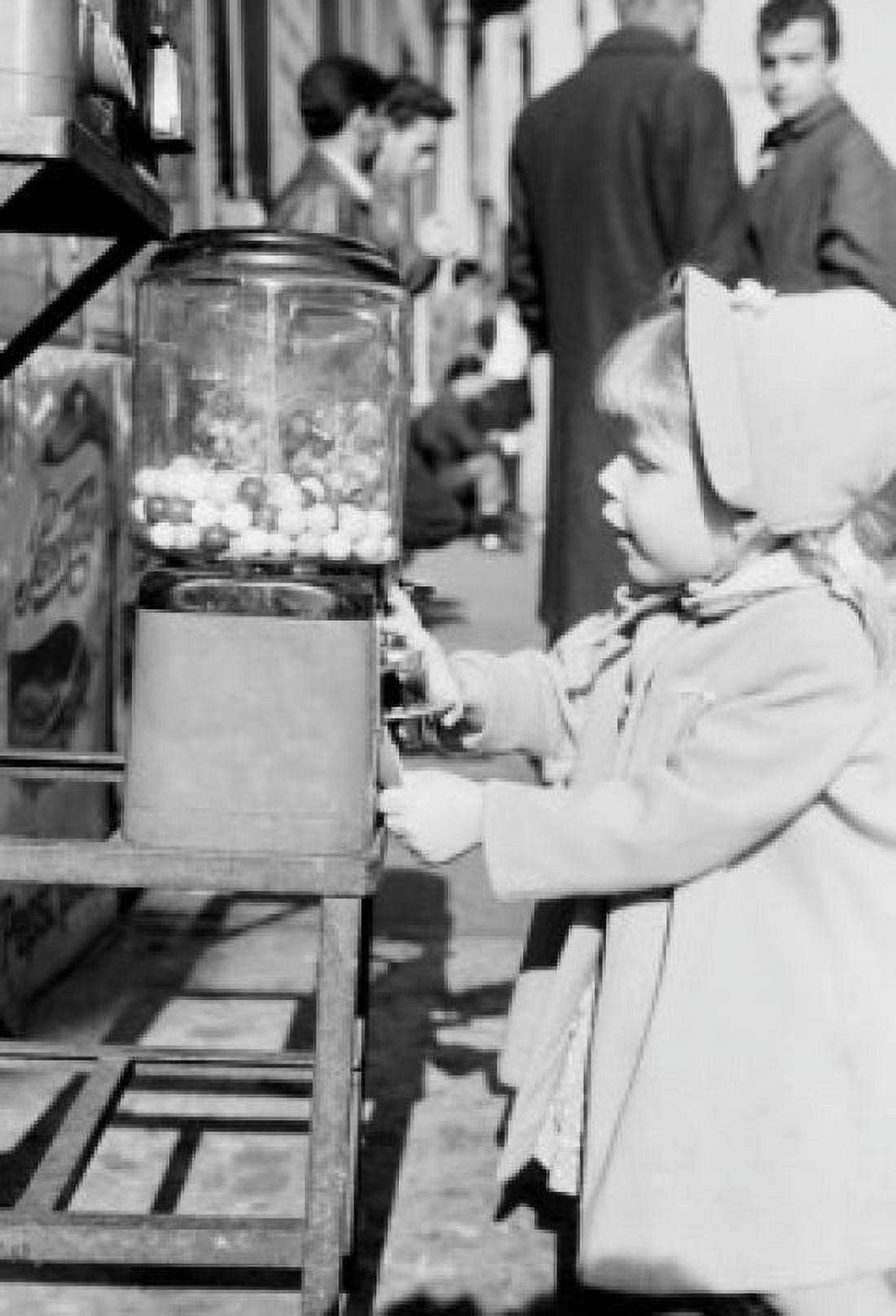 Little girl at Penny Ball gum machine Canvas Art - (24 x 36)