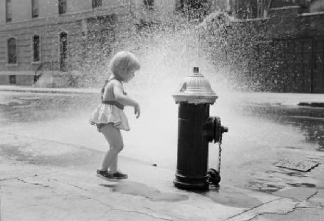 Little girl cooling off at fire hydrant on street Canvas Art -  (18 x 24)