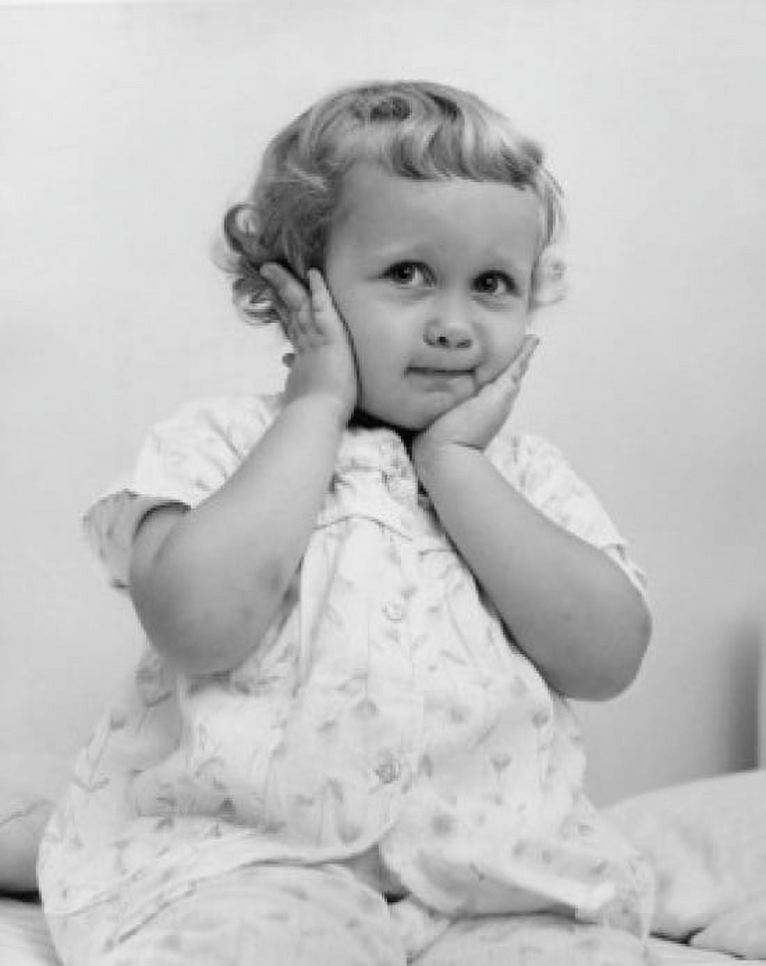 Little girl in pajamas with hands on her face Canvas Art - (18 x 24)