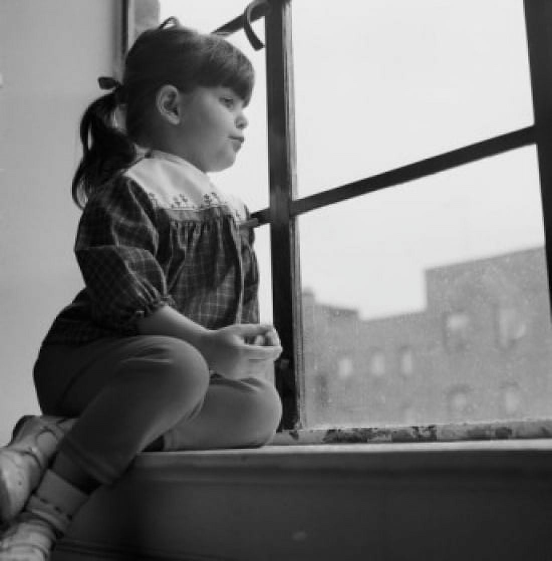 Little girl looking out window Canvas Art - (18 x 24)